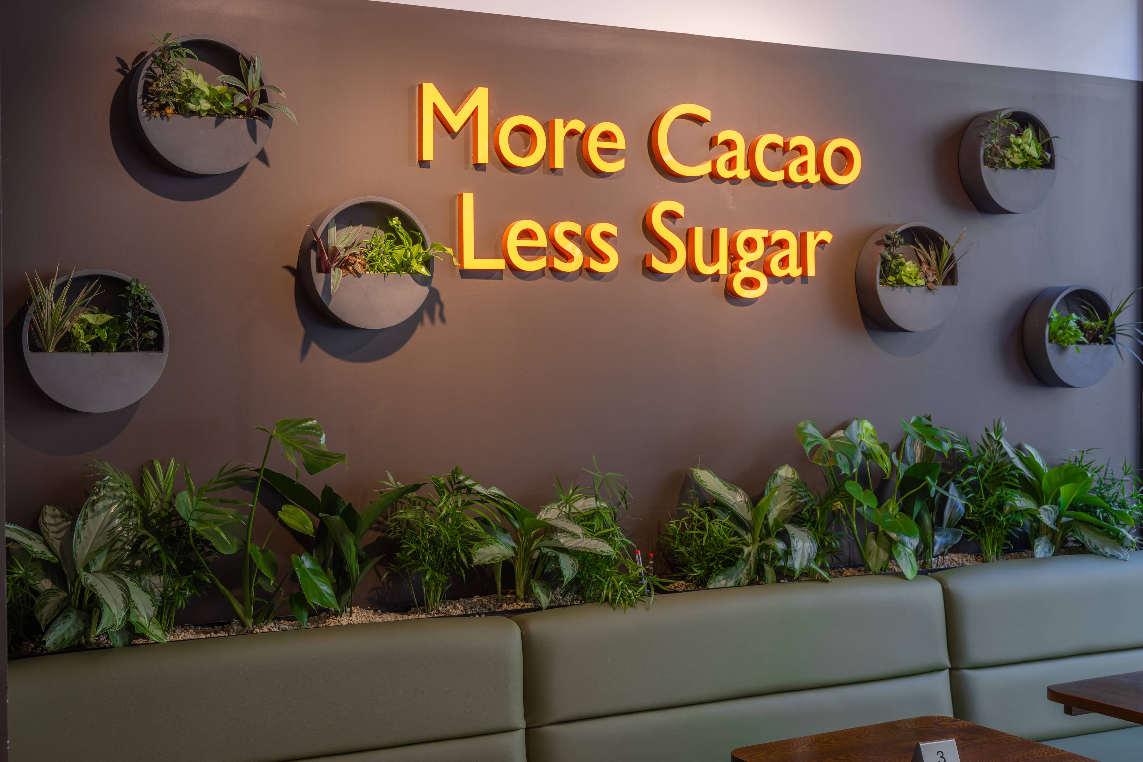 Integrated plant wall with text and wall planting