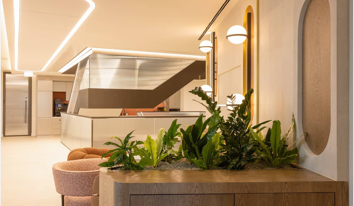 A futuristic office space with furniture planters in the fore